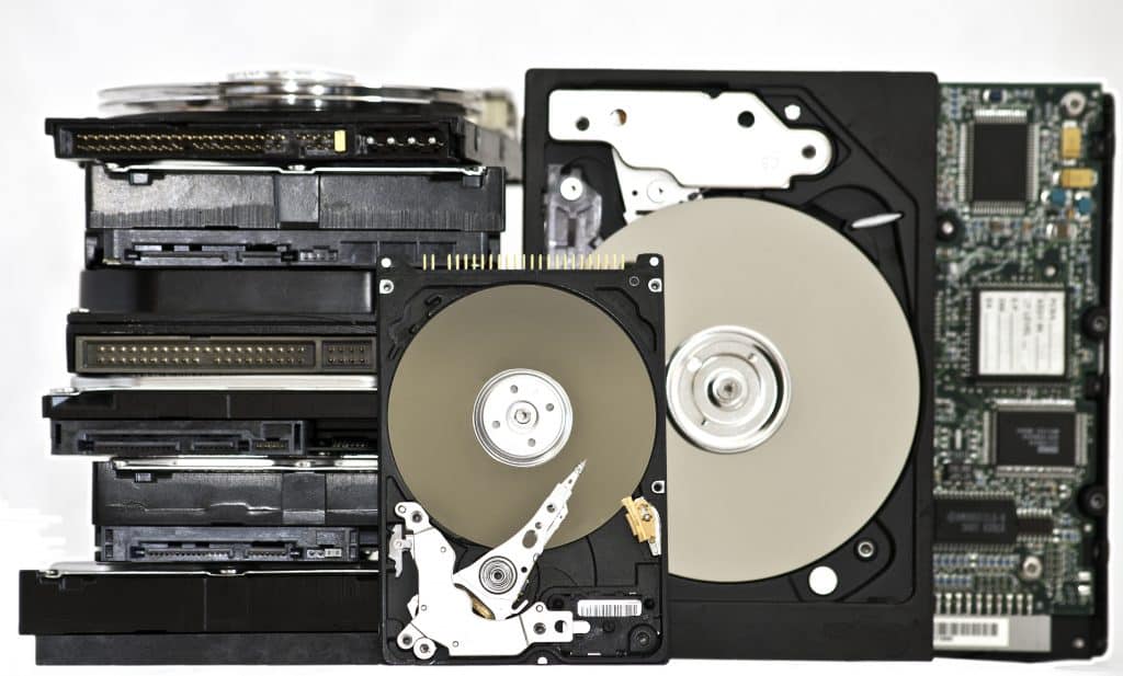 Many Open Hard drives isolated on white background.