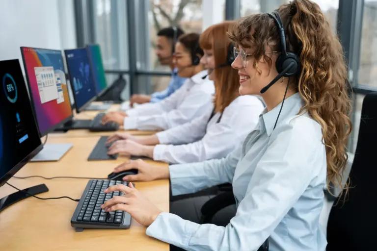 IT support team assisting small business employees in a modern office environment, representing professional small business IT support services.