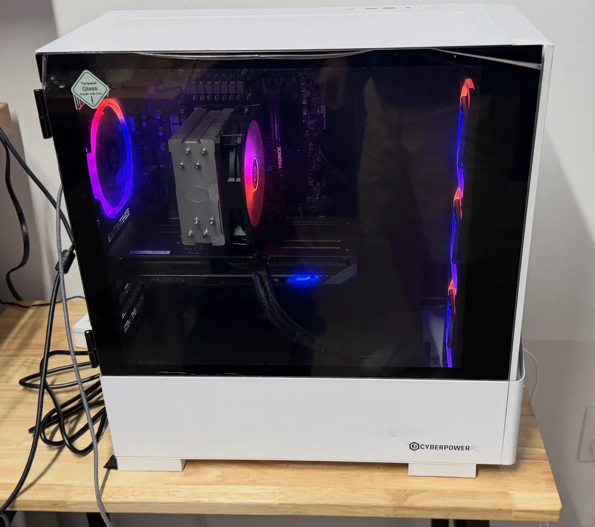 White CyberPowerPC prebuilt gaming PC with tempered-glass panel in for service on the bench